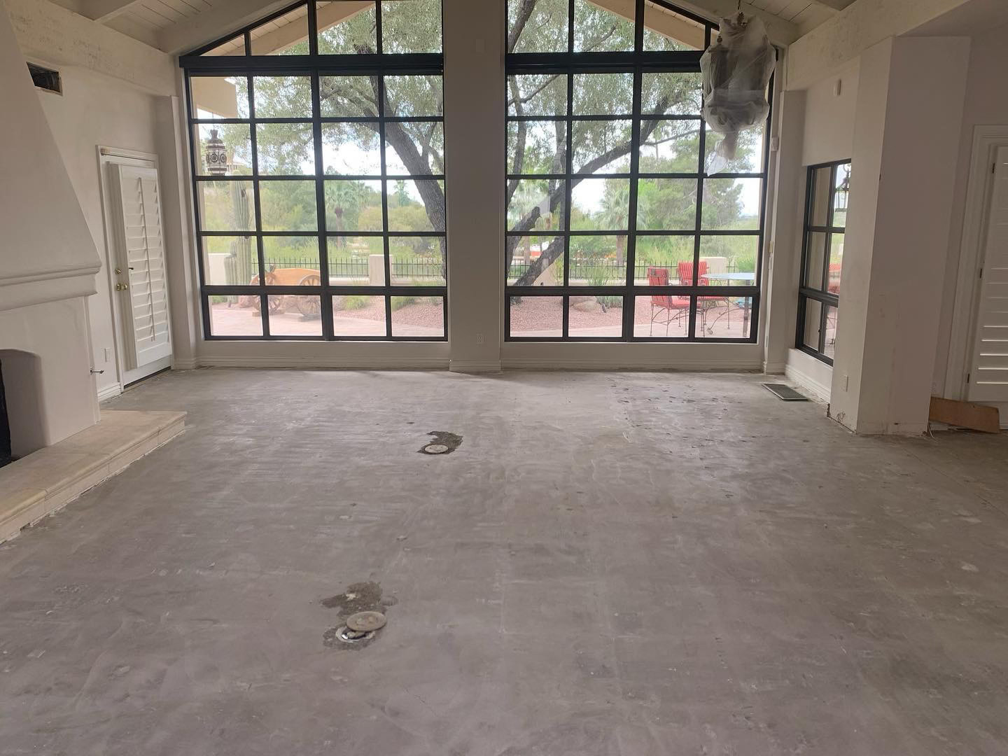 A render of three white cylindrical columns, against a warm creme background
